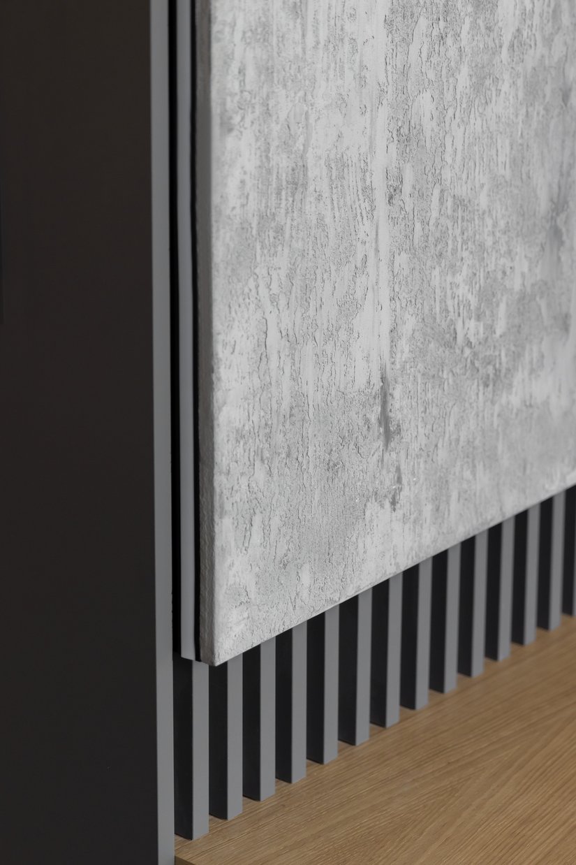 L'intonaco dall'effetto calcestruzzo grezzo assolutamente realistico è stato realizzato con Brillux Sentimento 78.