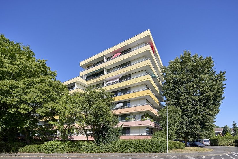 Finitura radiosa della bonifica del calcestruzzo: la nuova realizzazione cromatica dà vita al quartiere